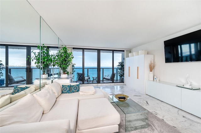 2301 S Ocean Dr Unit 1102, Hollywood, FL 33019 - living area featuring marble finish floor, a wealth of natural light, a water view, and floor to ceiling windows