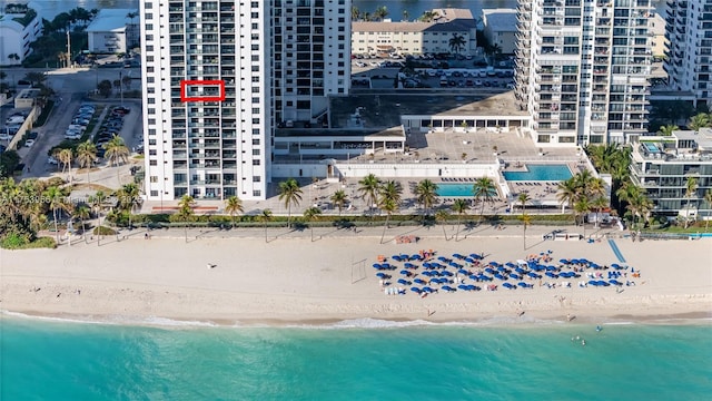 bird's eye view with a view of the beach and a water view