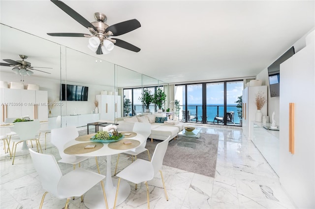 2301 S Ocean Dr Unit 1102, Hollywood, FL 33019 - dining space with expansive windows, marble finish floor, and a ceiling fan