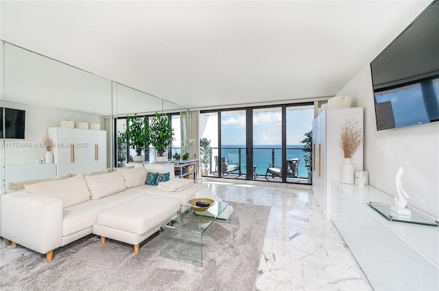 living room featuring marble finish floor and expansive windows