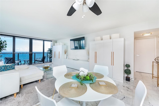 living room with marble finish floor and ceiling fan