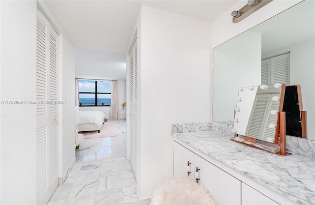 2301 S Ocean Dr Unit 1102, Hollywood, FL 33019 - ensuite bathroom with vanity, marble finish floor, connected bathroom, and a closet