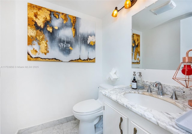 half bath featuring vanity, baseboards, visible vents, toilet, and marble finish floor