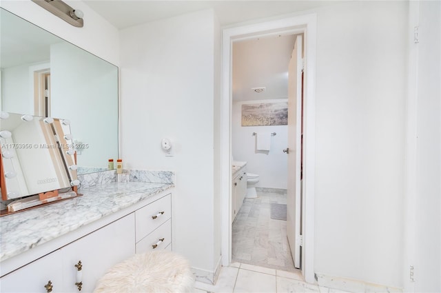 bathroom with vanity and toilet