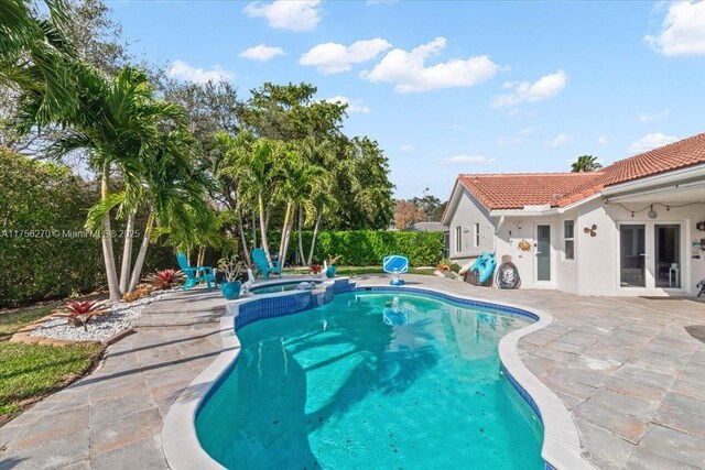 view of swimming pool with a patio and a fenced in pool