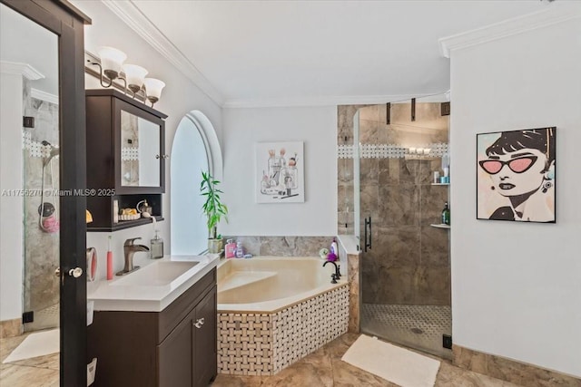 bathroom featuring a stall shower, a garden tub, crown molding, and vanity