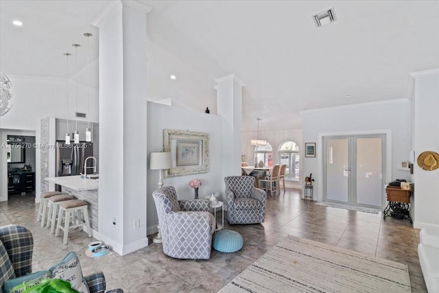 living room featuring high vaulted ceiling, baseboards, visible vents, and crown molding