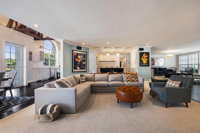 living area featuring a chandelier, recessed lighting, plenty of natural light, and wood finished floors