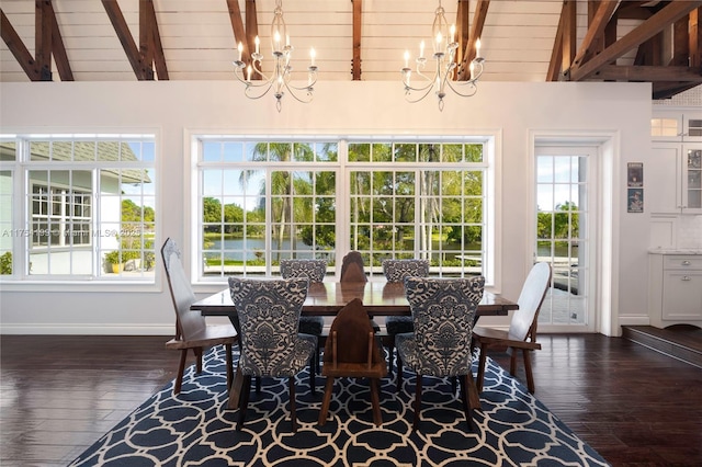 dining area with dark wood-style flooring, vaulted ceiling with beams, and an inviting chandelier