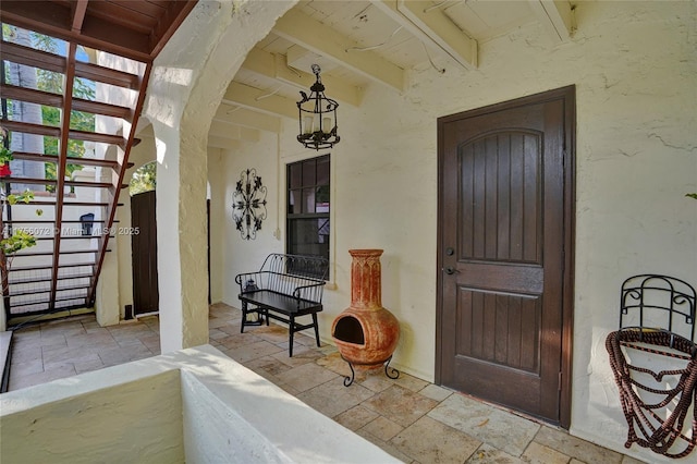 view of exterior entry featuring stucco siding