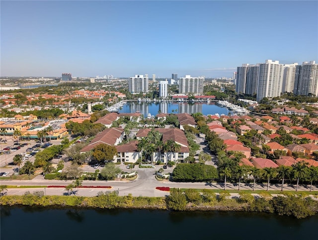 birds eye view of property featuring a view of city and a water view