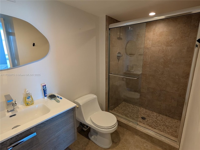 full bath with vanity, tile patterned flooring, a shower stall, and toilet