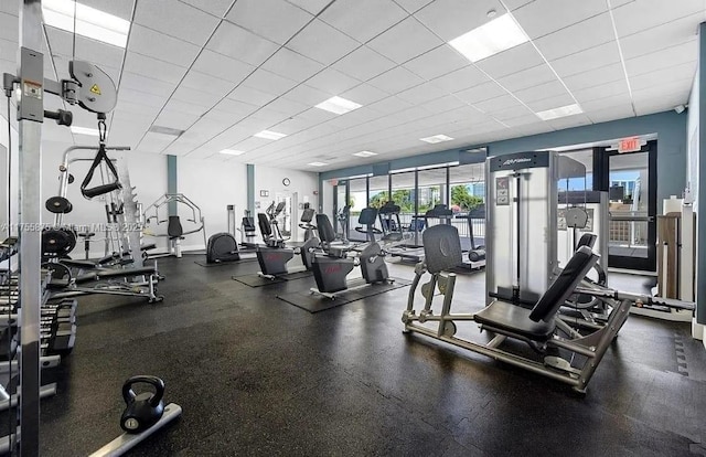 workout area with a drop ceiling