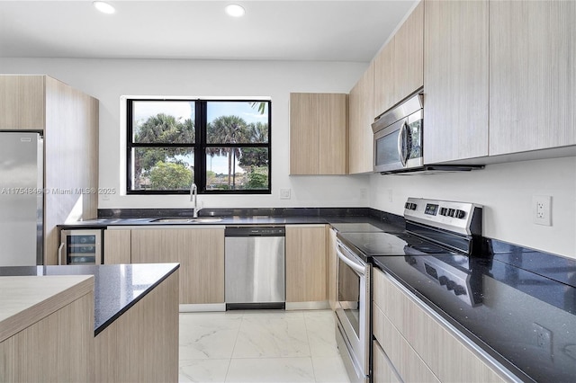 kitchen with wine cooler, marble finish floor, stainless steel appliances, light brown cabinetry, and dark stone counters