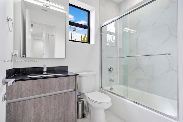 full bath with toilet, combined bath / shower with glass door, and vanity