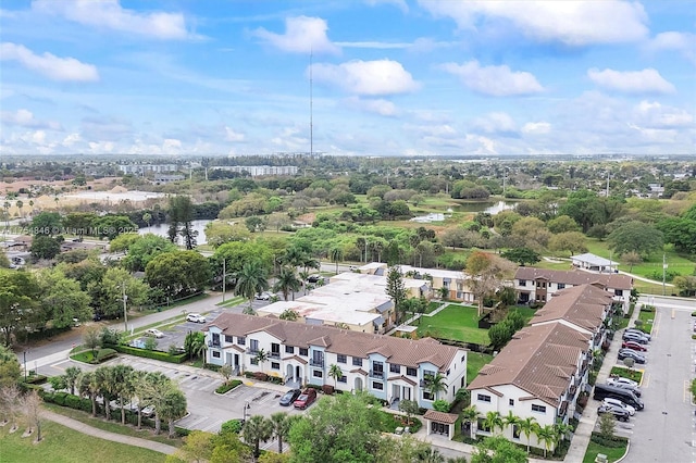 bird's eye view with a water view and a residential view