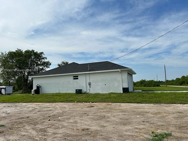 view of home's exterior featuring stucco siding and a garage