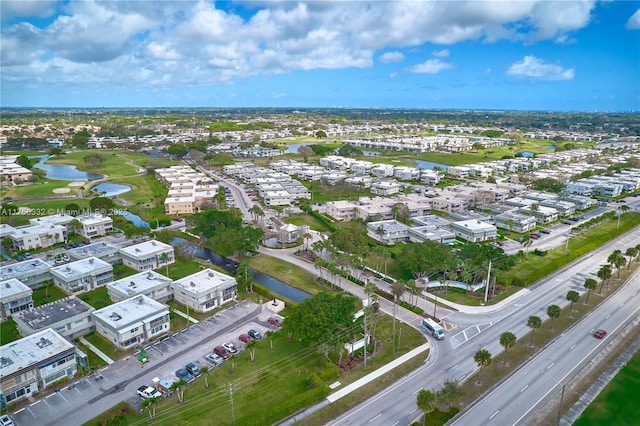 bird's eye view featuring a water view and a residential view