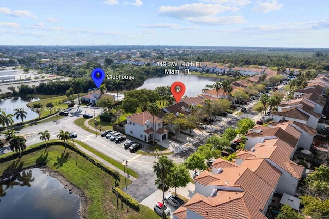 birds eye view of property featuring a water view and a residential view