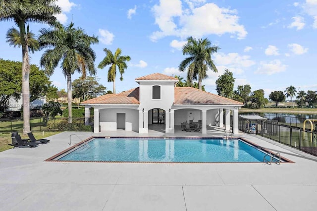 pool featuring a patio area and fence