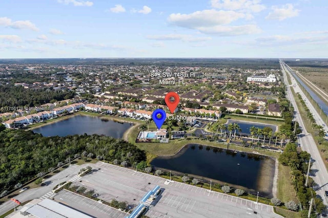 birds eye view of property featuring a water view