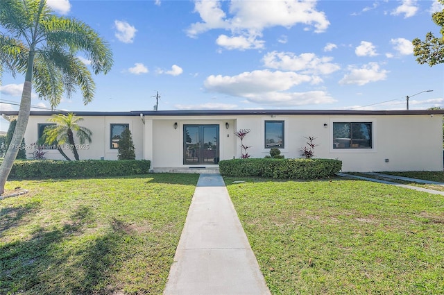 single story home with french doors, a front lawn, and stucco siding