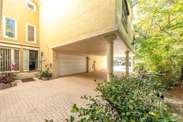 exterior space featuring visible vents and decorative driveway