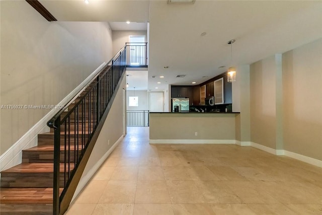 staircase featuring recessed lighting and baseboards