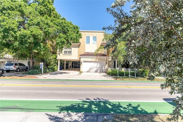 view of front of house with driveway and stucco siding