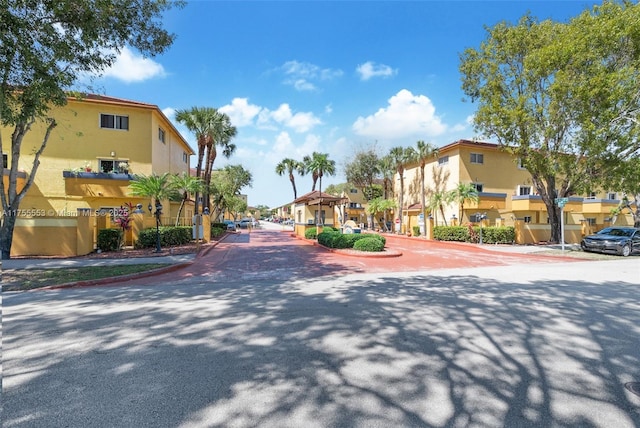 view of road with curbs and a residential view