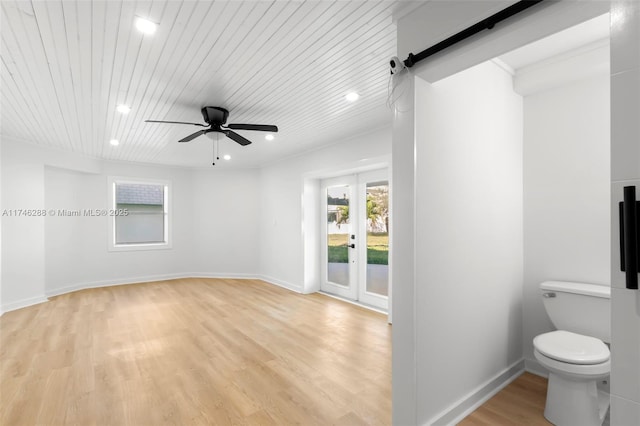 bathroom featuring ceiling fan, wooden ceiling, wood finished floors, and baseboards