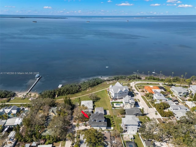 drone / aerial view with a water view and a residential view