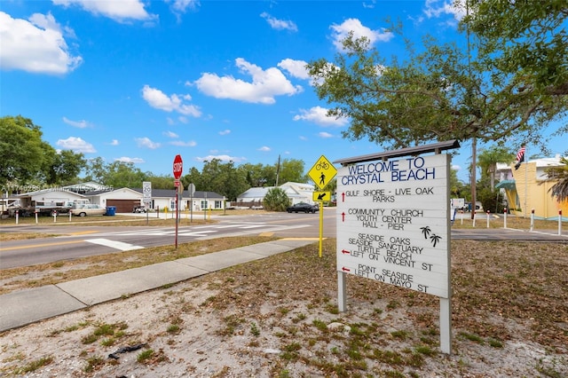 view of street featuring traffic signs and sidewalks