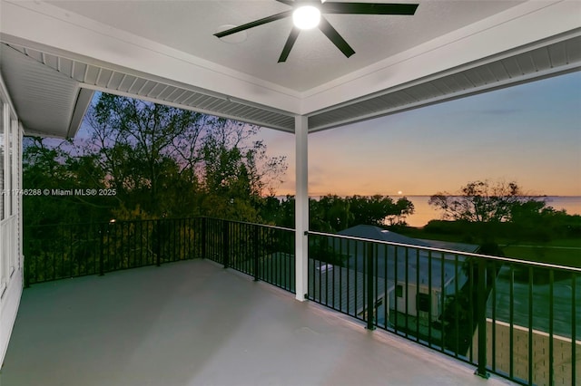 view of patio featuring a balcony and ceiling fan