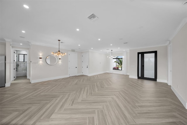 unfurnished living room with visible vents, a notable chandelier, and baseboards