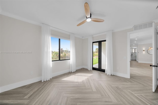 empty room with french doors, a ceiling fan, visible vents, and baseboards