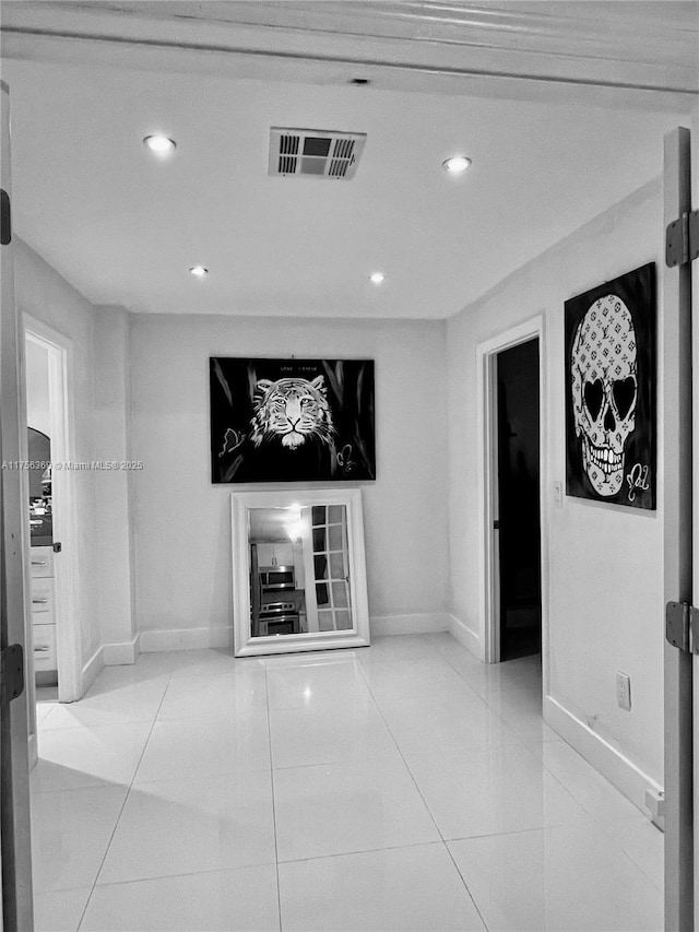 living room featuring recessed lighting, visible vents, baseboards, and tile patterned floors