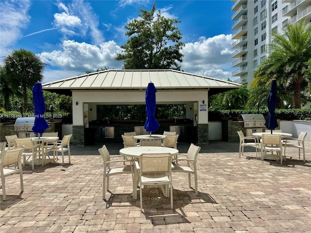 2801 NE 183rd St Unit 215W, Aventura, FL 33160 - view of patio with outdoor dining area and a gazebo