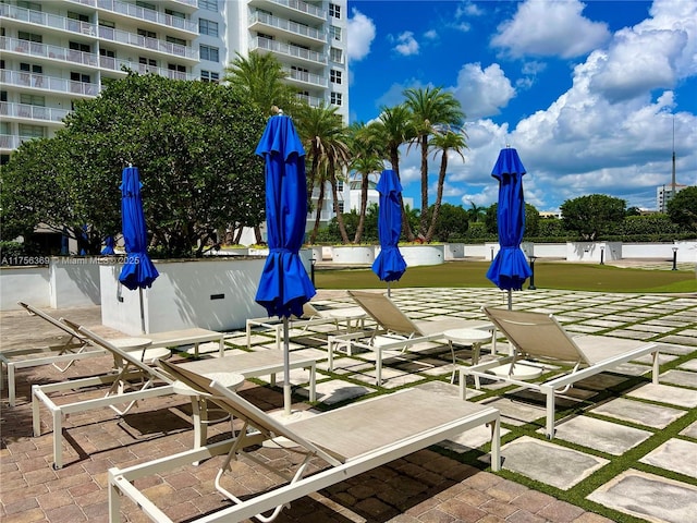 view of home's community featuring a patio area