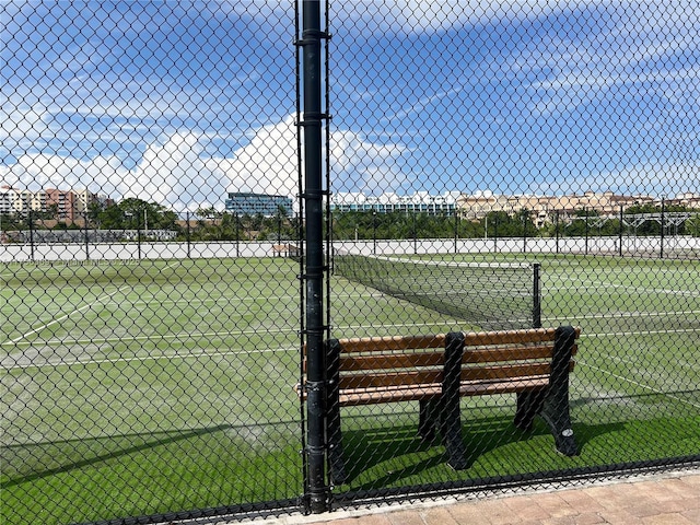 view of sport court with fence