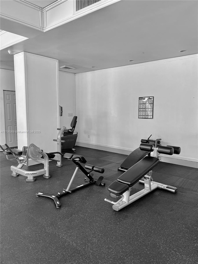 exercise room featuring visible vents and baseboards