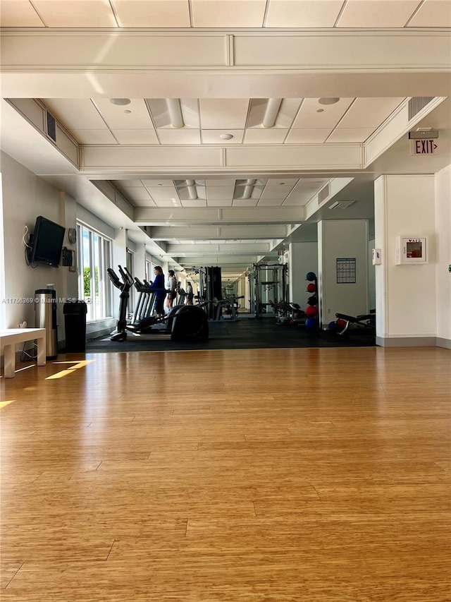 workout area featuring wood finished floors