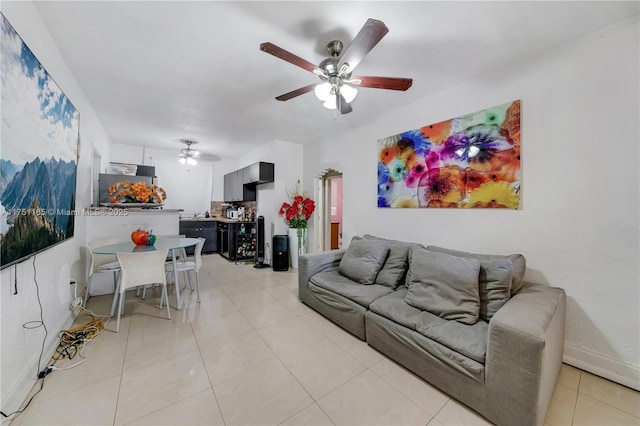 living room with ceiling fan and light tile patterned floors