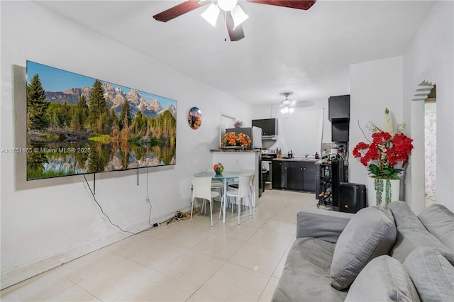 living room featuring light tile patterned floors and ceiling fan