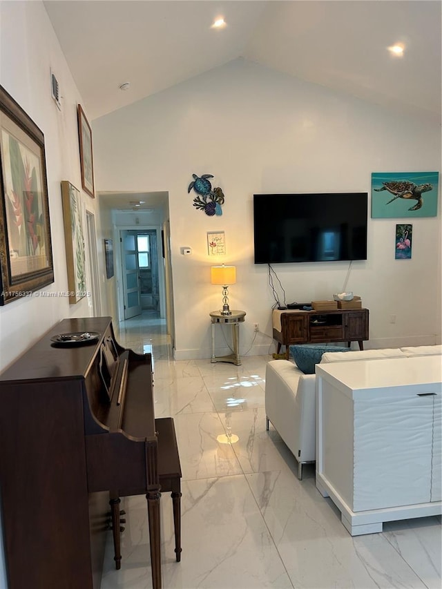 213 Florida Ave, Coral Gables, FL 33133 - living room with light marble finish flooring, vaulted ceiling, baseboards, and recessed lighting