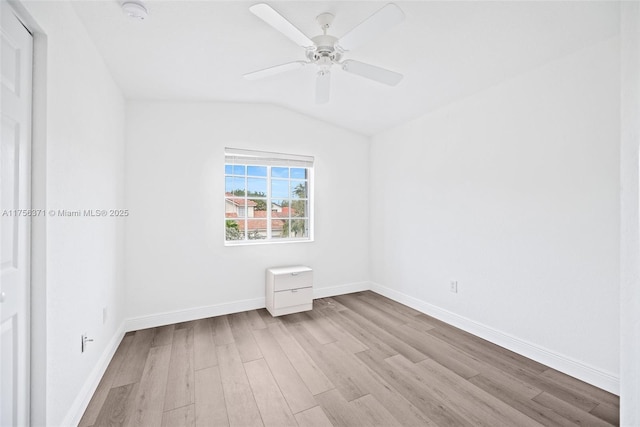 unfurnished room with baseboards, wood finished floors, a ceiling fan, and vaulted ceiling