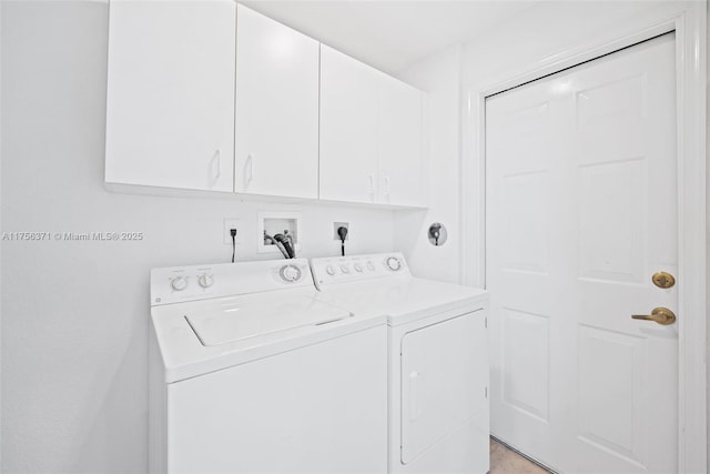 washroom with separate washer and dryer and cabinet space