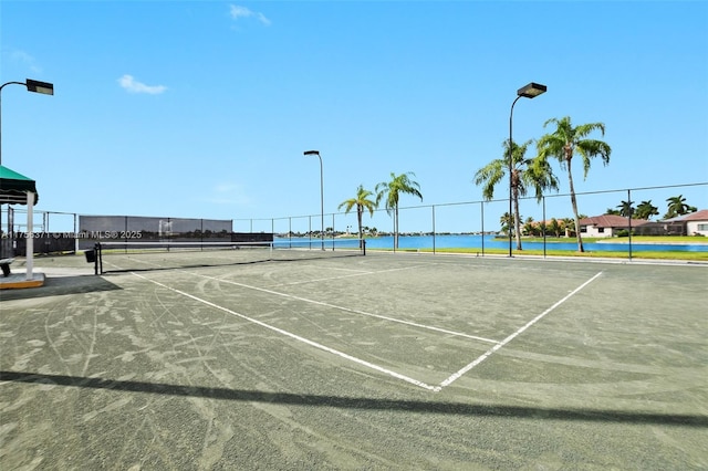 view of tennis court with fence
