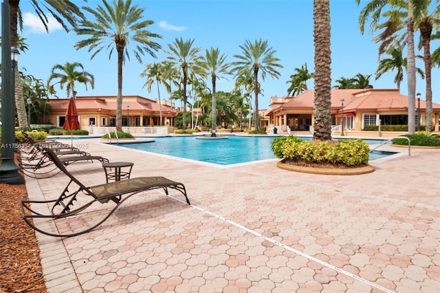 community pool with a patio area