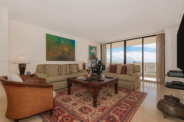 living room featuring tile patterned flooring and expansive windows